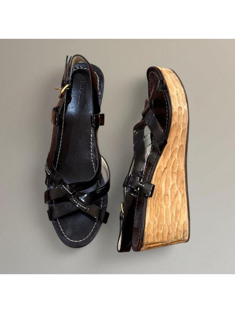 Miu Miu patent wedge sandals.